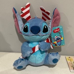 Disney Holiday Stitch with a candy cane and Reindeer Antlers